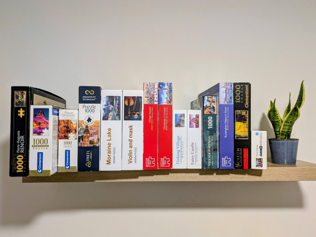 Real photograph of Masha's home puzzle shelf